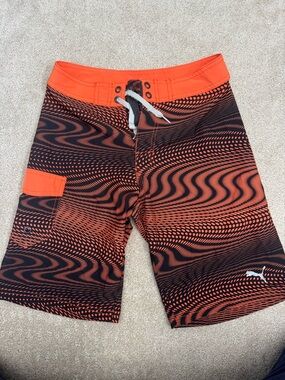 Puma Kids Orange and Black Wavy Pattern Swim Trunks- M (10-12)